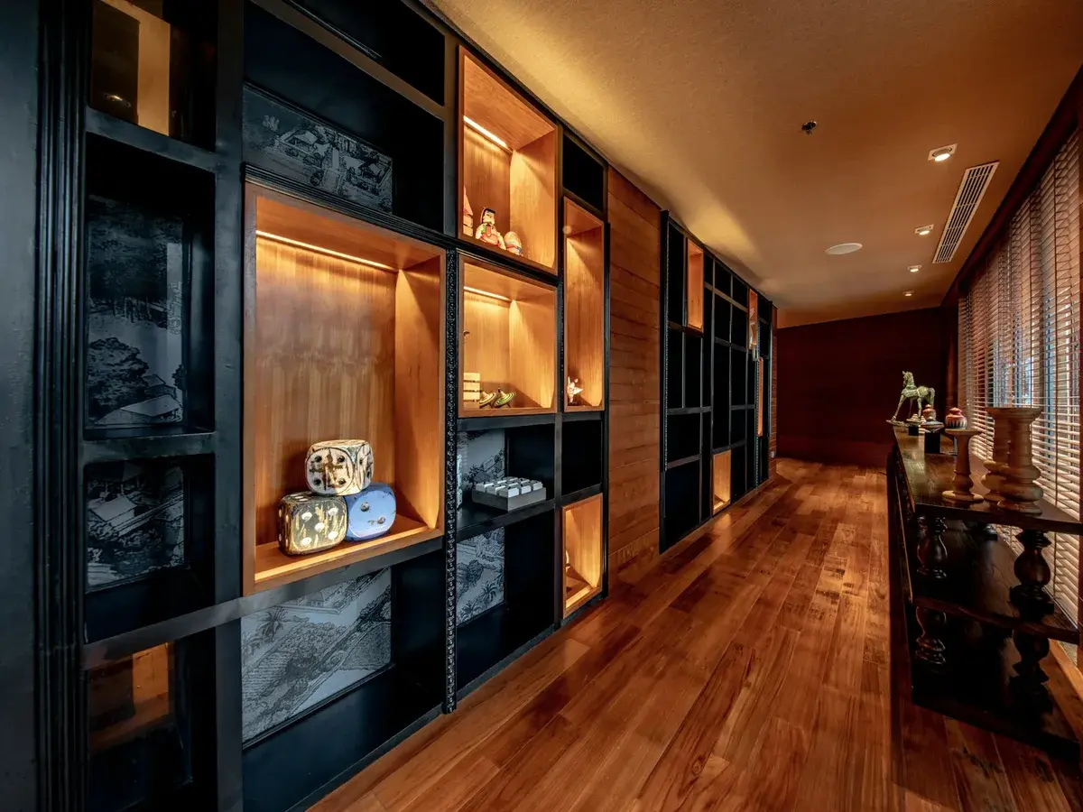 Backlit walk in wardrobe finished in dark veneer in Narsingi, Hyderabad